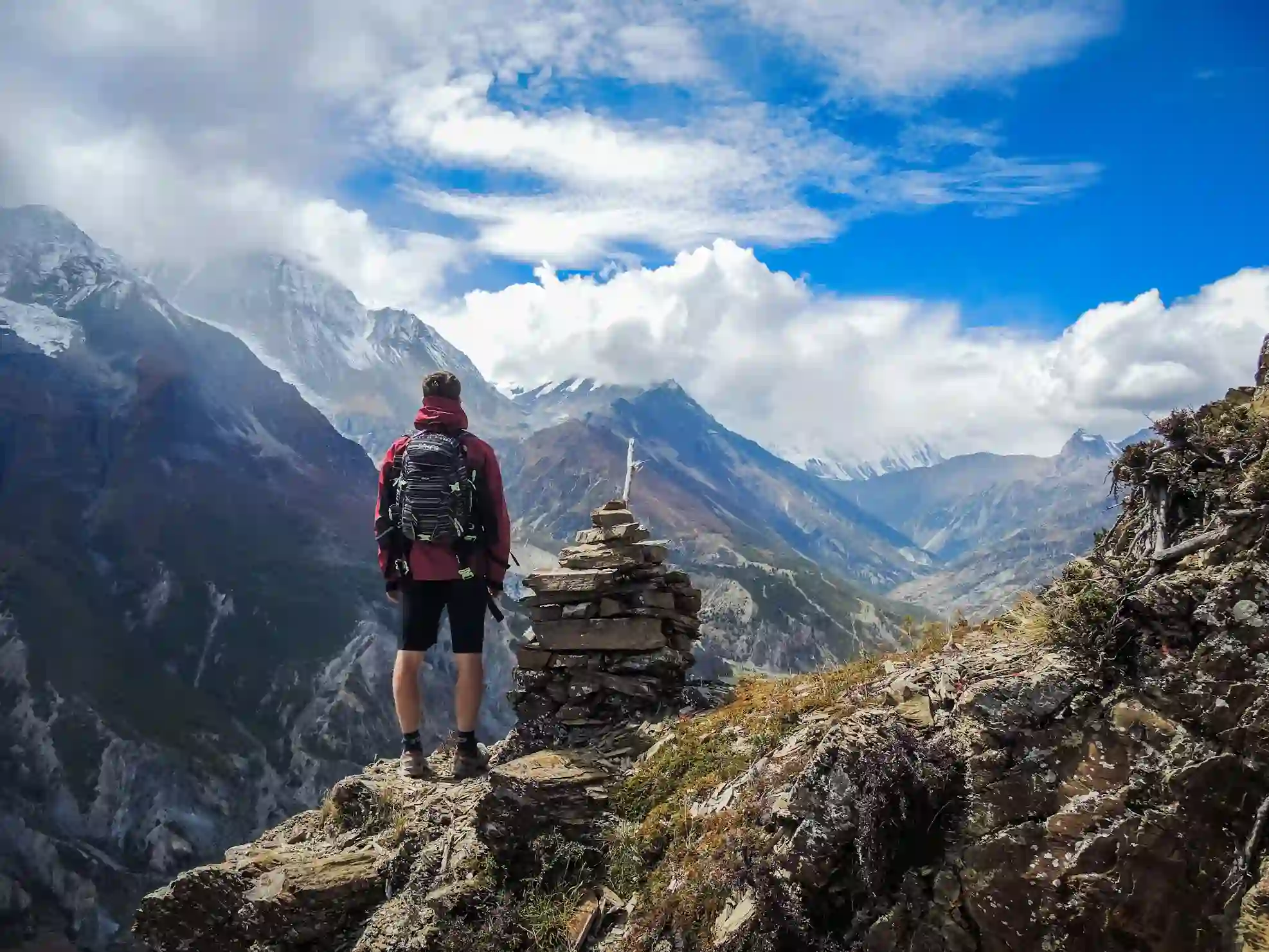 Happy adventurers celebrating on a mountain peak